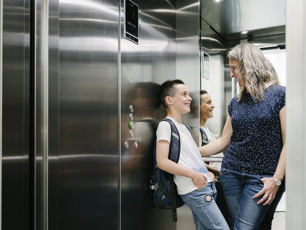 Mother and her child in a lift