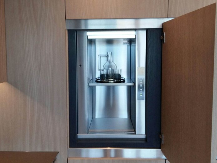 Dumbwaiter with a glass and a bottle residential housing